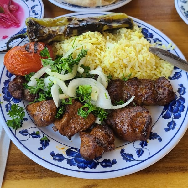 Elena's Greek Armenian Restaurant's shish kebab with rice, grilled tomato, pepper, onions, and parsley.